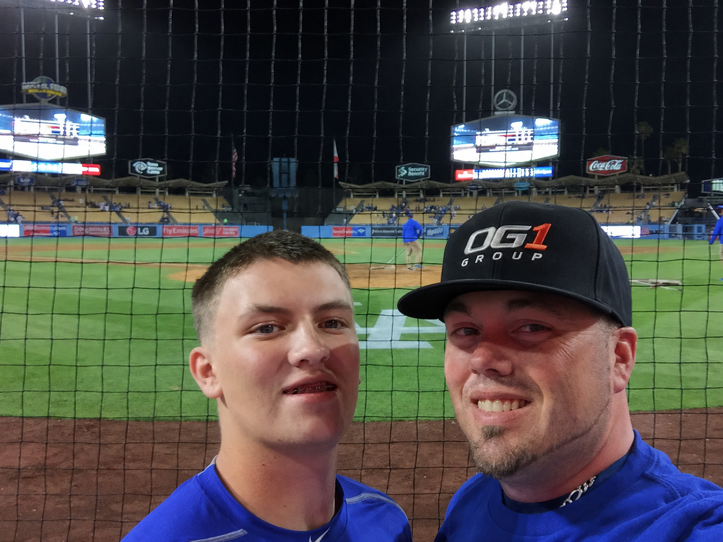 Garrett and Ryan Young at Dodger Stadium wearing OG1 Group gear